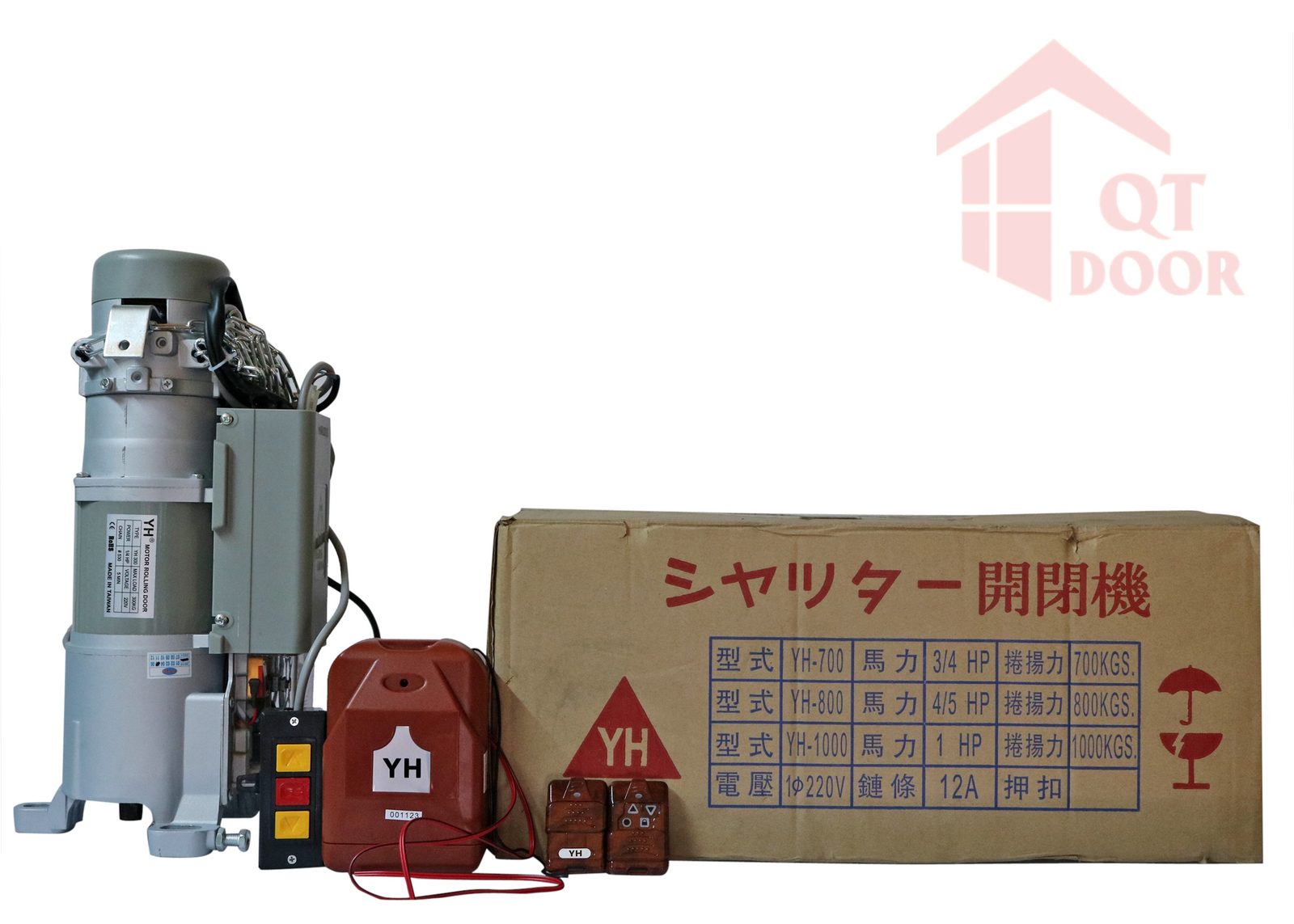 Bộ motor cửa cuốn YH gồm motor, hộp nhận tín hiệu, nút bấm gắn tường và 2 tay remote, đặt cạnh thùng hàng